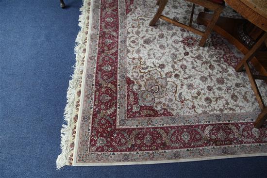 A modern Turkish Tabriz style part silk carpet, 9ft 10in by 6ft 8in.